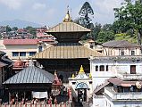 Kathmandu Pashupatinath 14 Pashupatinath Temple From Across River There is a very good view of the Pashupatinath temple complex from across the river on the eastern side. The central two-tiered pagoda dates from 1696.